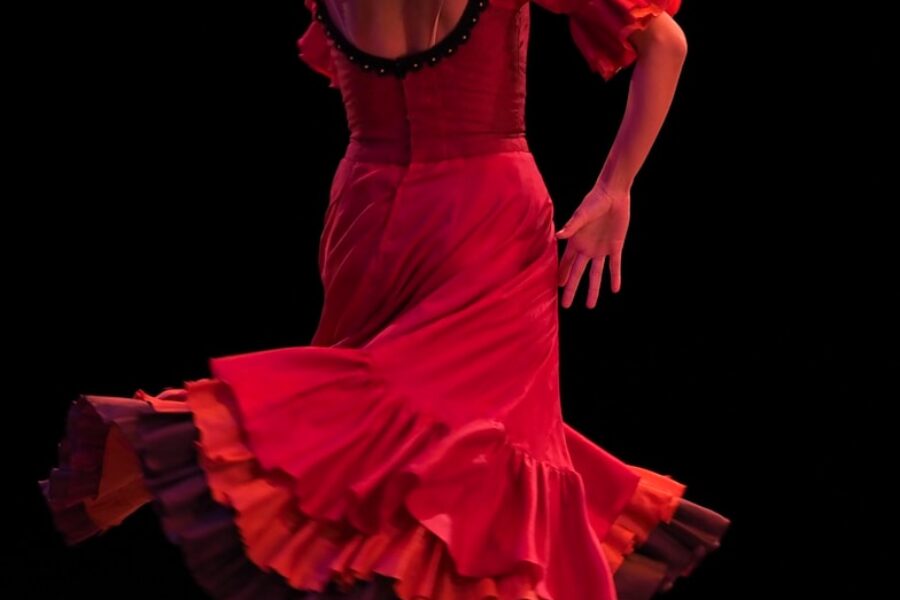 woman in red dress holding red heart