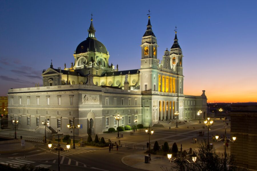 a large building lit up at night with lights on