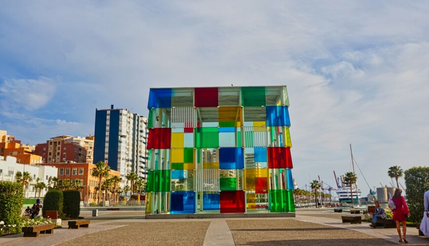 A multicolored building sitting on the side of a road