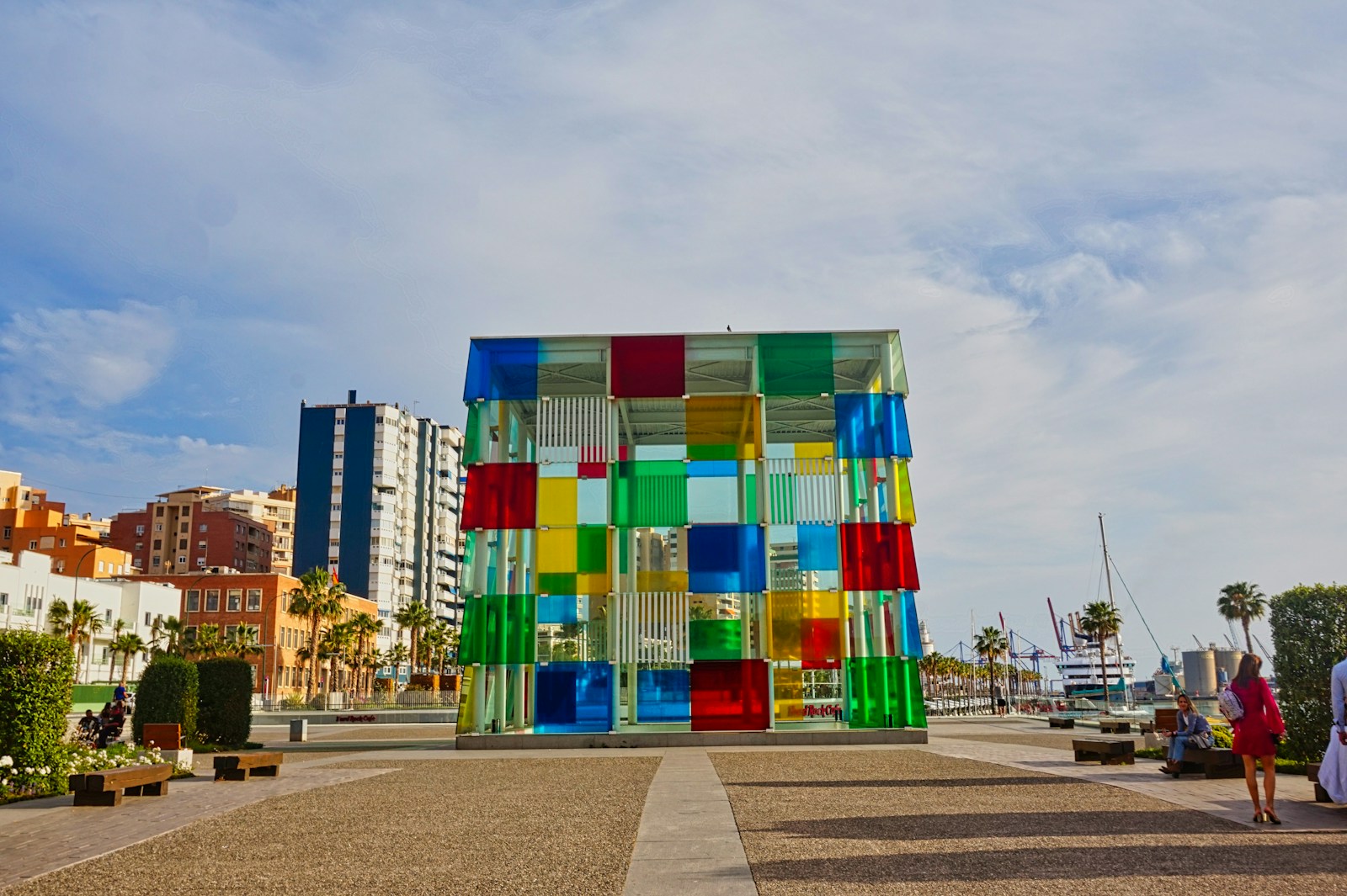 A multicolored building sitting on the side of a road