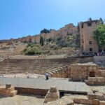 A group of people standing on top of a cliff